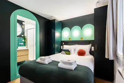 Un ou plusieurs lits dans un hébergement de l'établissement Stunning apartment - 2BR-6P - Paris Center