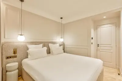 Un ou plusieurs lits dans un hébergement de l'établissement Maison Iéna - Serviced Apartments on Champs Elysées