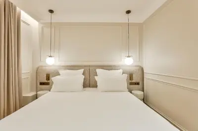 Un ou plusieurs lits dans un hébergement de l'établissement Maison Iéna - Serviced Apartments on Champs Elysées