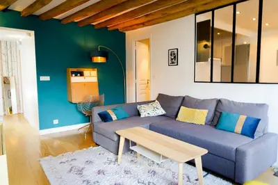 Coin salon dans l'établissement Appartement Chic & Spacieux | Paris 2ème
