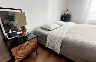 Un ou plusieurs lits dans un hébergement de l'établissement Beau et charmant appartement à Bastille