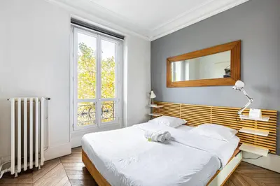 Un ou plusieurs lits dans un hébergement de l'établissement GuestReady - Séjour Cosy Familial pour 4