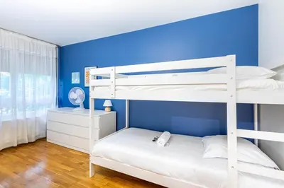 Un ou plusieurs lits dans un hébergement de l'établissement GuestReady - Séjour Élégant à Paris pour 6