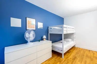 Un ou plusieurs lits dans un hébergement de l'établissement GuestReady - Séjour Élégant à Paris pour 6