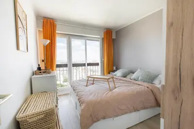 Un ou plusieurs lits dans un hébergement de l'établissement Appartement Élégant à Montmartre