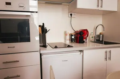 Cuisine ou kitchenette dans l'établissement Studio confortable et moderne au cœur de Paris