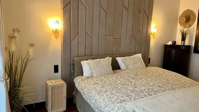 Un ou plusieurs lits dans un hébergement de l'établissement Appartement au Cœur des Ternes - Arc de Triomphe