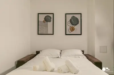 Un ou plusieurs lits dans un hébergement de l'établissement MBA - Beslay - Splendide Appartement Paris Centre
