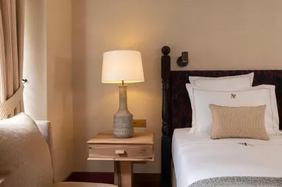 Un ou plusieurs lits dans un hébergement de l'établissement Hôtel Aubépine