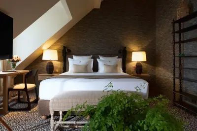 Un ou plusieurs lits dans un hébergement de l'établissement Hôtel Aubépine