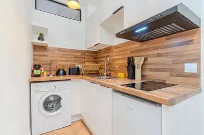 Cuisine ou kitchenette dans l'établissement L'Échappée de Paris I Stade de France I Couple I Famille I Business
