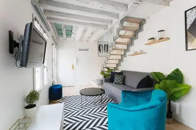 Télévision ou salle de divertissement dans l'établissement Central Appartement - Sentier