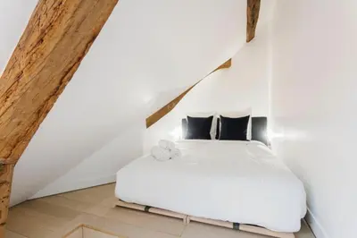 Un ou plusieurs lits dans un hébergement de l'établissement Central Appartement - Sentier