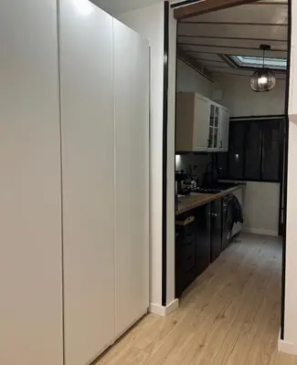 Cuisine ou kitchenette dans l'établissement Charmant studio en ville