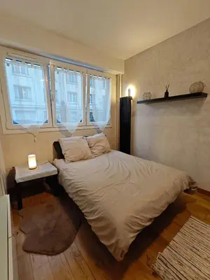 Un ou plusieurs lits dans un hébergement de l'établissement Studio Paris Montmorency