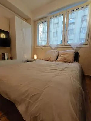 Un ou plusieurs lits dans un hébergement de l'établissement Studio Paris Montmorency