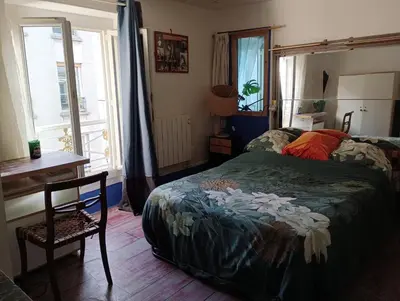 Un ou plusieurs lits dans un hébergement de l'établissement Paris Centre appartement 2 chambre