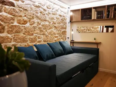 Coin salon dans l'établissement Maison Moisan - studio 27m2 à Paris 6e