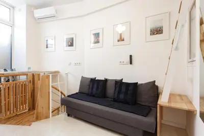 Coin salon dans l'établissement Appartement Petits Champs