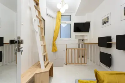 Télévision ou salle de divertissement dans l'établissement Appartement Petits Champs
