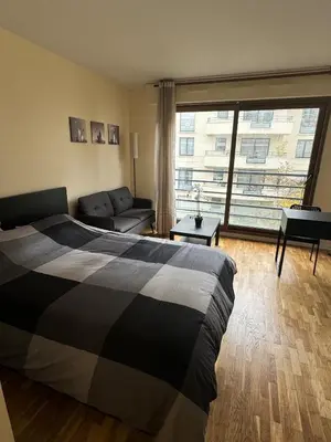 Un ou plusieurs lits dans un hébergement de l'établissement Studio neuf proche de Paris