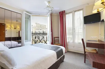 Un ou plusieurs lits dans un hébergement de l'établissement Hotel du College de France