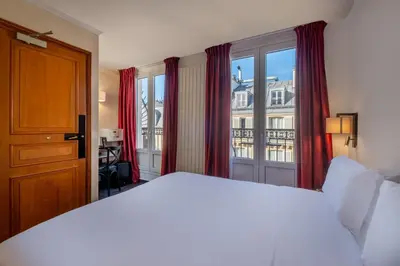 Un ou plusieurs lits dans un hébergement de l'établissement Hotel du College de France