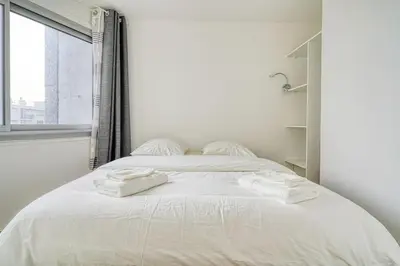 Un ou plusieurs lits dans un hébergement de l'établissement Cozy apartment 5 people Tour Eiffel - Champ de Mars
