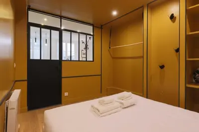 Un ou plusieurs lits dans un hébergement de l'établissement Chic apartment - 1BR-4P - Center of Paris