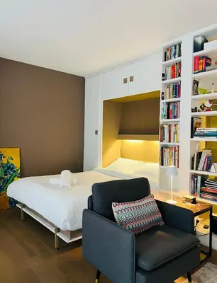 Un ou plusieurs lits dans un hébergement de l'établissement Another Cozy Flat near St-Germain, St-Placide