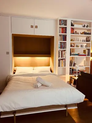 Un ou plusieurs lits dans un hébergement de l'établissement Another Cozy Flat near St-Germain, St-Placide