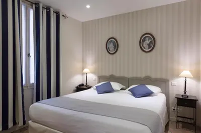 Un ou plusieurs lits dans un hébergement de l'établissement Hotel Mogador