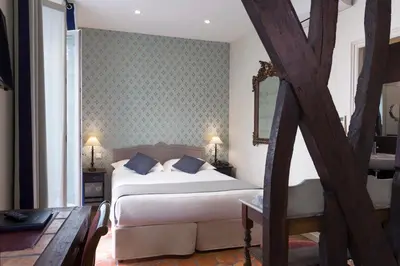 Un ou plusieurs lits dans un hébergement de l'établissement Hotel Mogador