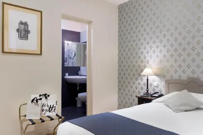Un ou plusieurs lits dans un hébergement de l'établissement Hotel Mogador