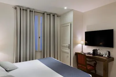Un ou plusieurs lits dans un hébergement de l'établissement Hotel Mogador