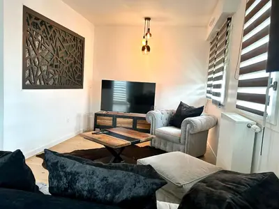 Télévision ou salle de divertissement dans l'établissement La belle vie