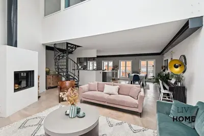 Coin salon dans l'établissement Triplex Atypique à 10mn de Paris
