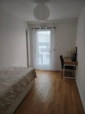 Un ou plusieurs lits dans un hébergement de l'établissement Grand appartement familial paris13