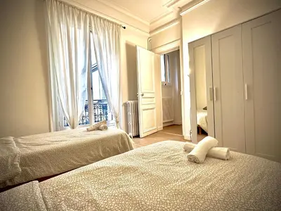 Un ou plusieurs lits dans un hébergement de l'établissement Champs Élysées appartement 5