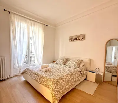 Un ou plusieurs lits dans un hébergement de l'établissement Champs Élysées appartement 5