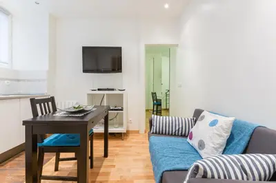 Télévision ou salle de divertissement dans l'établissement Appartement Petits Champs II