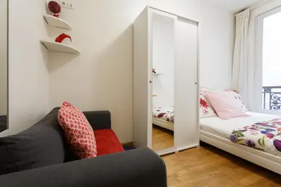 Un ou plusieurs lits dans un hébergement de l'établissement Appartement Petits Champs II