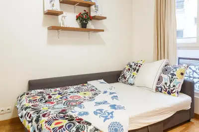 Un ou plusieurs lits dans un hébergement de l'établissement Appartement Petits Champs II