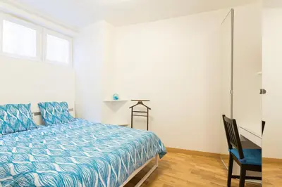 Un ou plusieurs lits dans un hébergement de l'établissement Appartement Petits Champs II