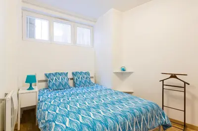 Un ou plusieurs lits dans un hébergement de l'établissement Appartement Petits Champs II