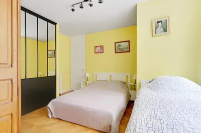 Un ou plusieurs lits dans un hébergement de l'établissement Bright Getaway near Montparnasse