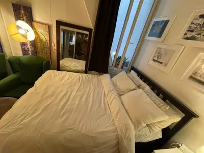 Un ou plusieurs lits dans un hébergement de l'établissement Appartement Paris