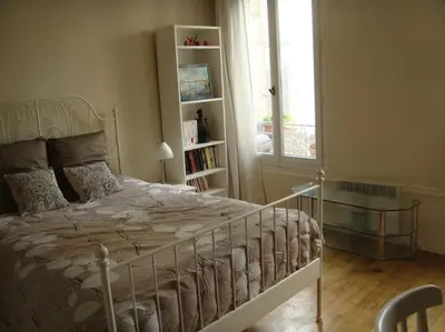 Un ou plusieurs lits dans un hébergement de l'établissement Grand Appartment 