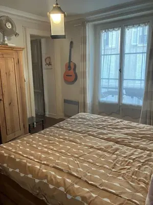 Un ou plusieurs lits dans un hébergement de l'établissement Grand Appartment 