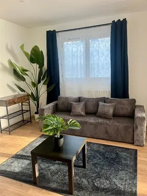 Coin salon dans l'établissement Appartement en duplex - M4 et RER B Arcueil-Cachan